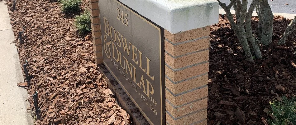 Mulch used as ground cover for landscape bed with sign in Bartow, FL.