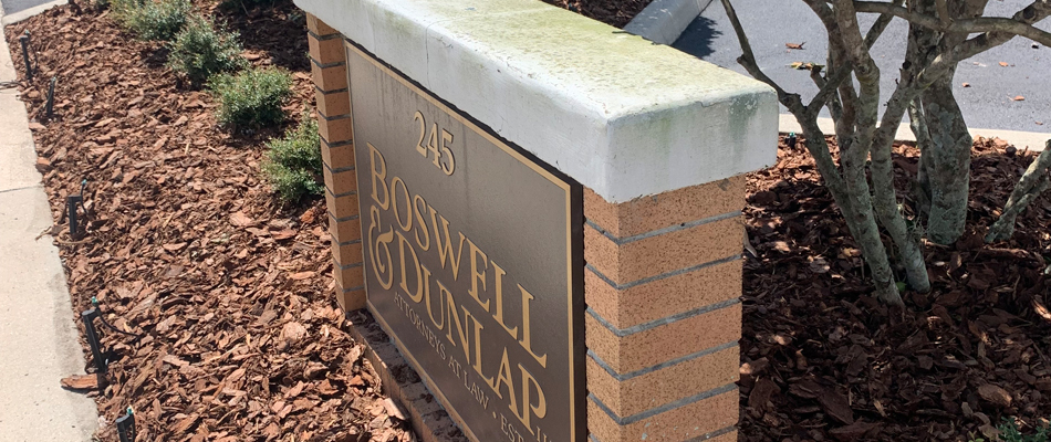 Dark mulch installed around custom landscaping at a Boswell & Dunlap in Winter Haven, FL.